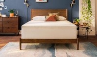A Cloud topper on a mattress in a styled room