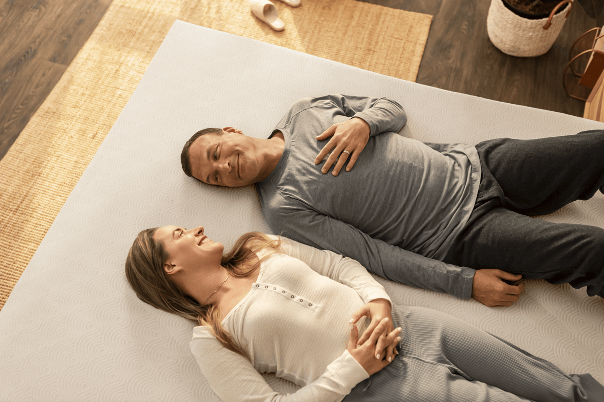 couple laying on 3 inch cloud topper