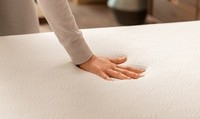 Hand pressing into a Cloud Topper